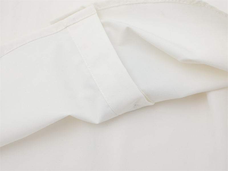 Close-up of white shirt sleeve cuff and seam detail