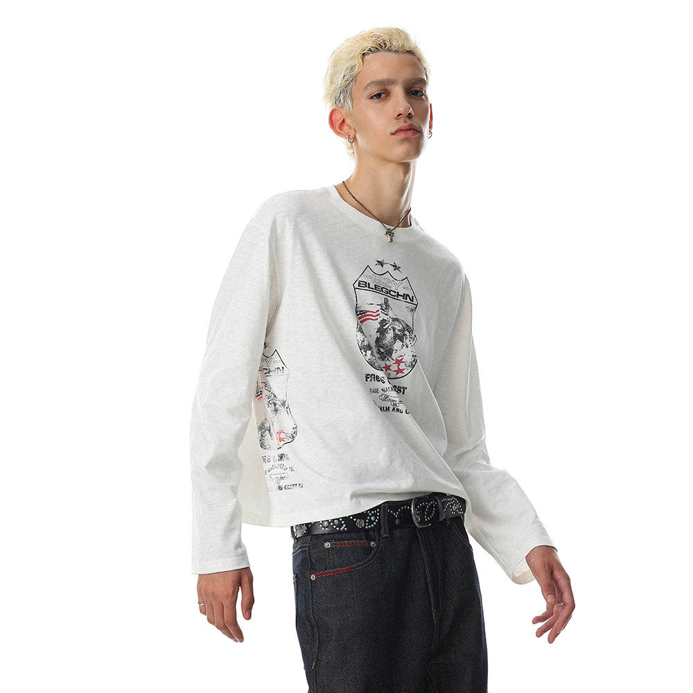 White long sleeve oversized tee with front graphic print, worn by model