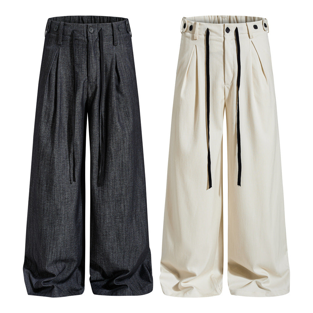 Men's wide-leg pleated trousers with drawstring waistband shown in charcoal and off-white colorways, front and back views