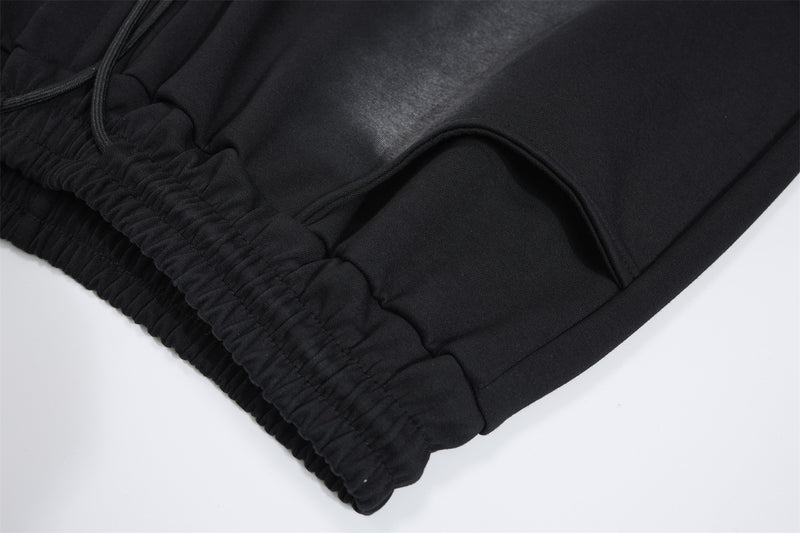 Pantalon de survêtement à jambes larges avec croix gothique et finition délavée