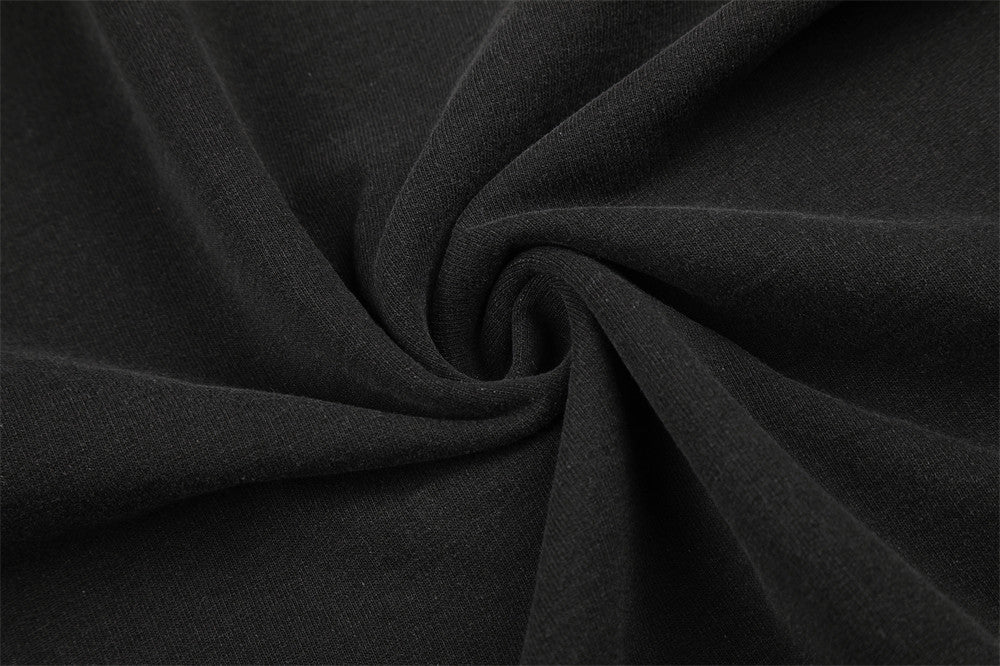 Close-up of black fabric texture gathered into a swirl
