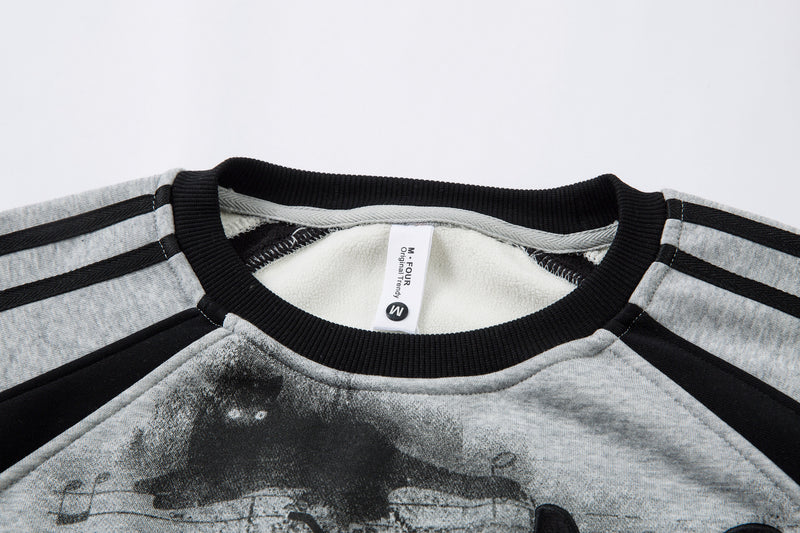 Sweat-shirt motif chat en smoking avec imprimé note de musique et manches raglan color block