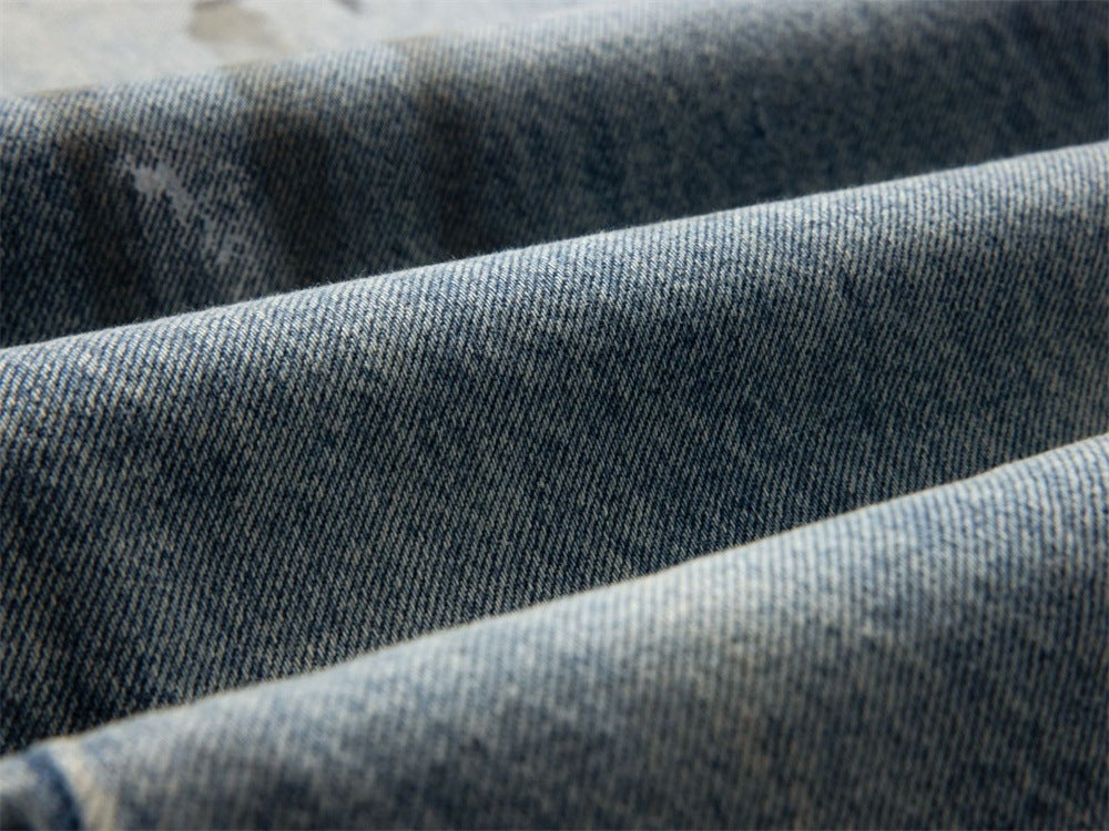 Close-up of blue denim fabric texture with dark washed weave