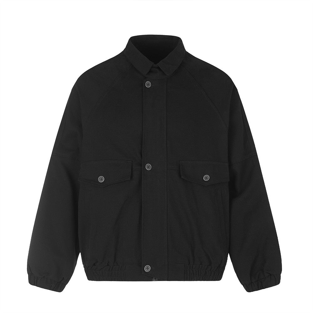 Oversized men's workwear bomber jacket in black with point collar, button-front closure, dual chest flap pockets, and elastic