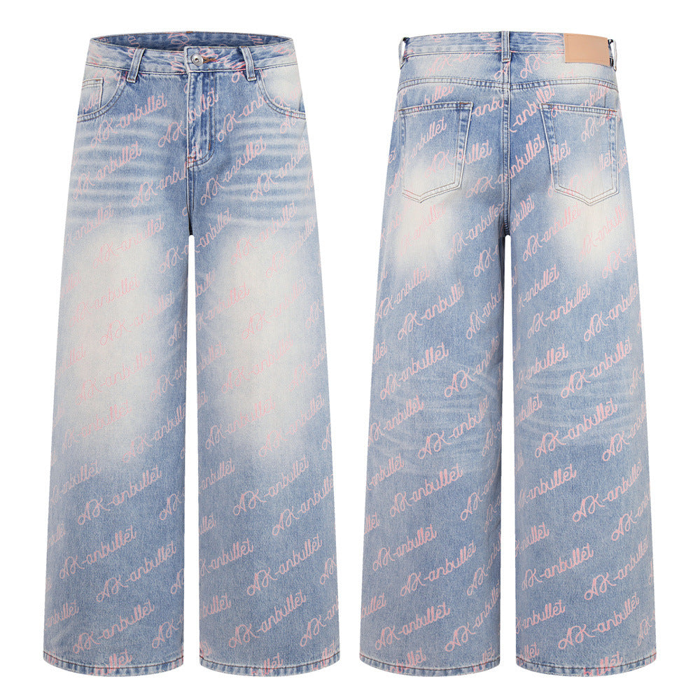 Wide-leg light blue washed denim jeans with allover pink cursive script print, front and back view