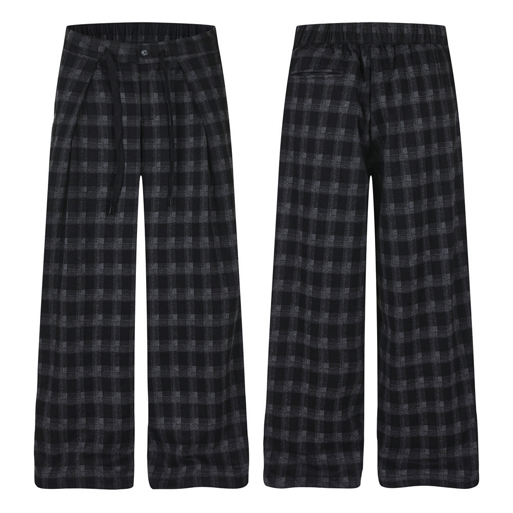 Men's wide-leg pleated trousers in black and grey check plaid, front and back view