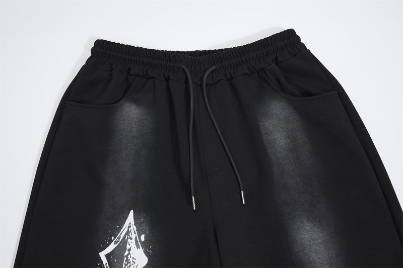 Pantalon de survêtement à jambes larges avec croix gothique et finition délavée