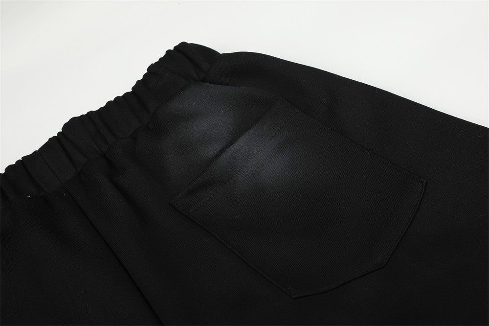Pantalones de chándal holgados de pernera ancha con lavado efecto spray y gráfico de letras