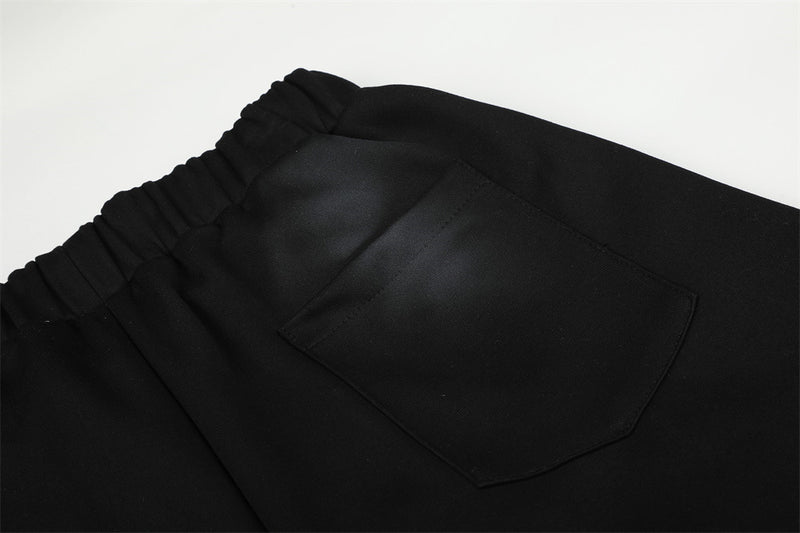 Pantalones de chándal holgados de pernera ancha con lavado efecto spray y gráfico de letras