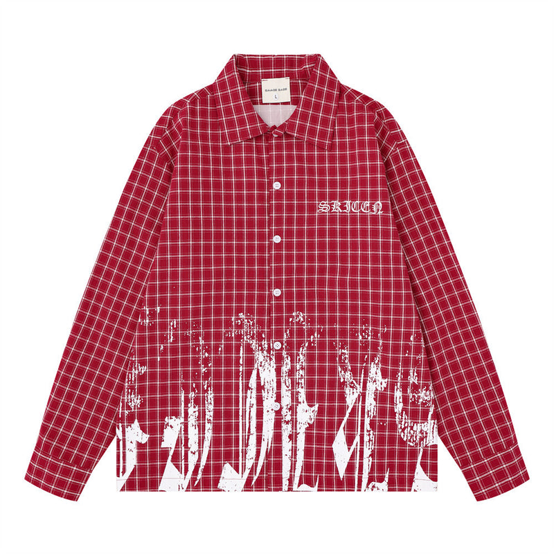 Oversized plaid long sleeve shirt in red with white graffiti brushstroke print and Old English embroidery on chest, front vie
