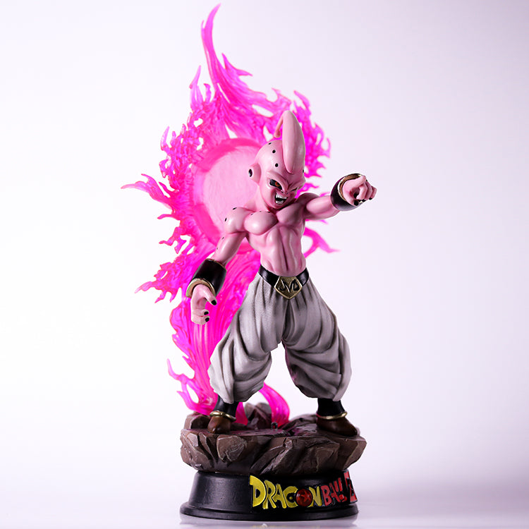 The Seakoff Majin Buu Collectible Figure from Dragon Ball Z stands 37cm tall, showcasing a muscular, pink-skinned character with a dynamic pose. It features thin head extensions, pointed ears, and an intense expression, surrounded by a glowing pink aura that enhances its menacing presence.