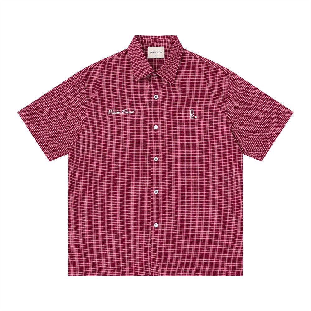 Oversized American casual plaid short sleeve shirt with white script embroidery on chest and back, shown in red colorway