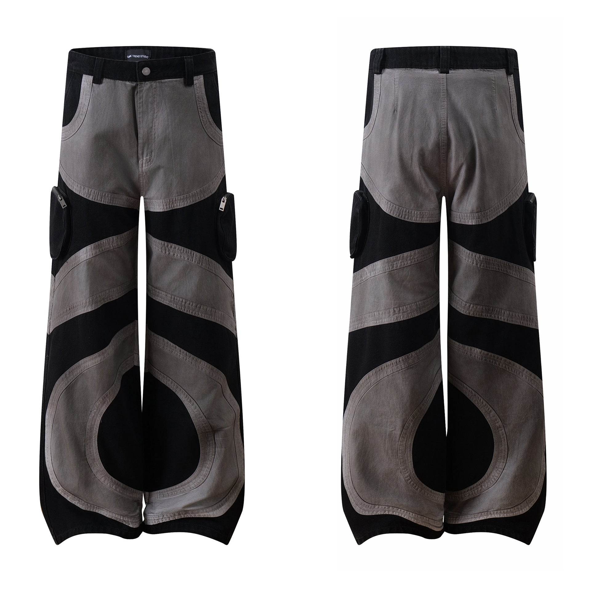 Men's baggy cargo pants in black and grey curved patchwork with wide-leg silhouette and zip cargo pockets, front and back vie