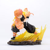 The Demon Slayer Zenitsu Agatsuma Figure, a 14.5cm high-quality PVC collectible weighing 300g, depicts Zenitsu in an action pose with orange hair and a black outfit. He stands on an electrifying base, wearing an eye-catching orange and yellow cloak that embodies Thunder Breathing.