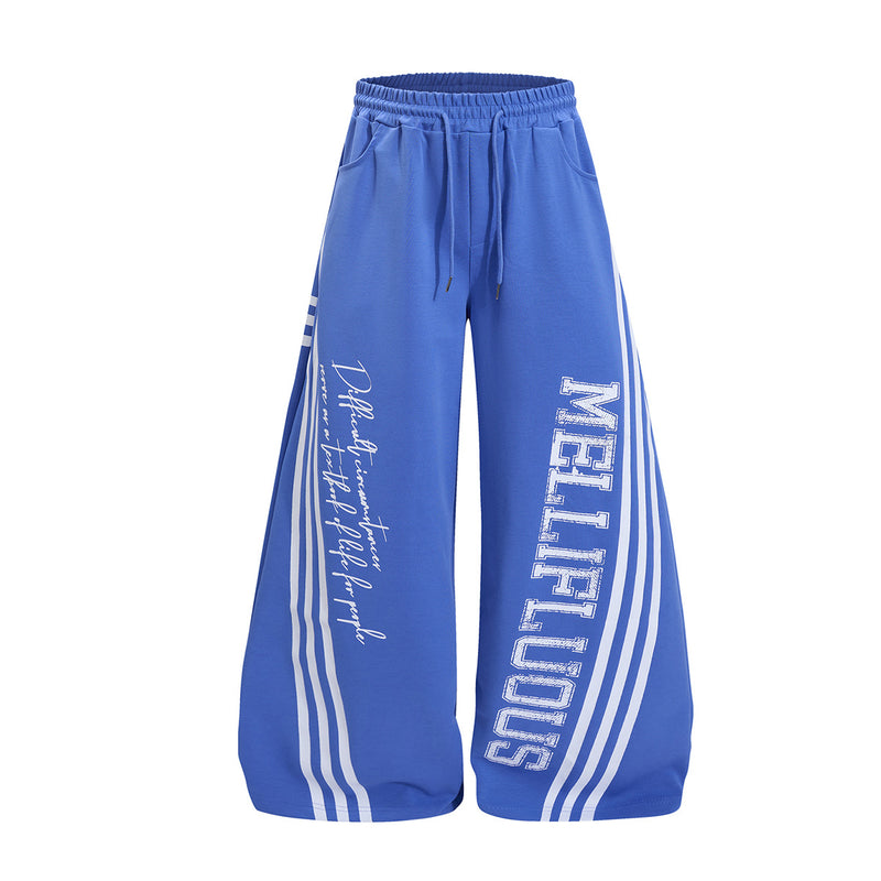 Wide leg sweatpants in royal blue with Mellifluous varsity graphic print and white stripe side detail