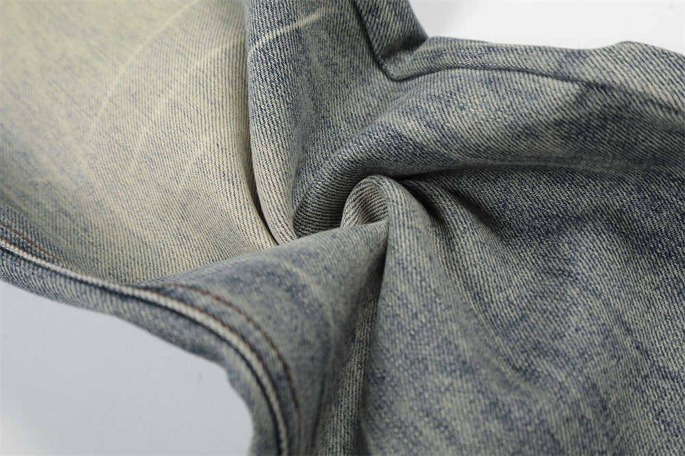 Vintage Washed Wide-Leg Flare Jeans – Distressed Faded Denim with Crease Detail