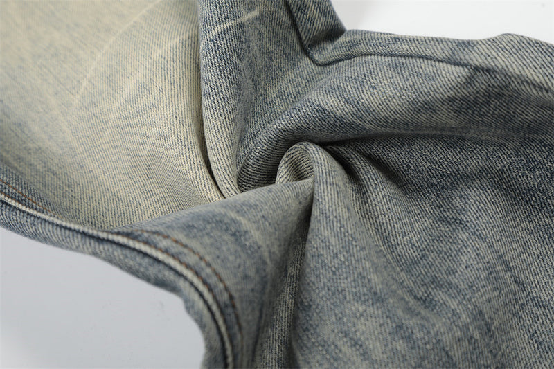 Vintage Washed Wide-Leg Flare Jeans – Distressed Faded Denim with Crease Detail