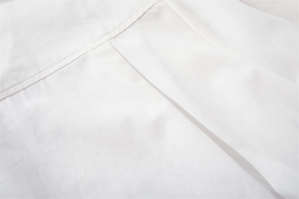Close-up of white shirt back yoke seam and shoulder panel