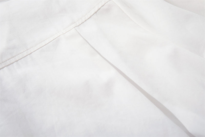 Close-up of white shirt back yoke seam and shoulder panel