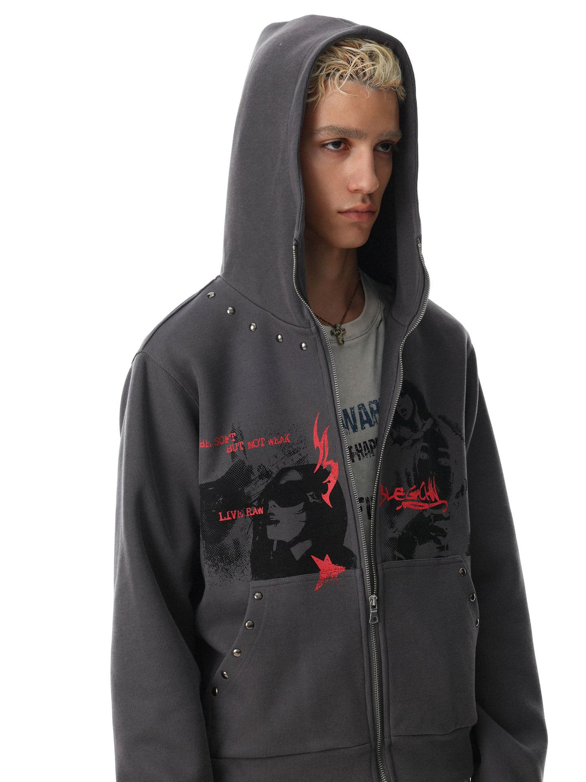 Dark grey zip-up hoodie with halftone anime graphic print, red flame motifs, and metal stud detailing on shoulder seams