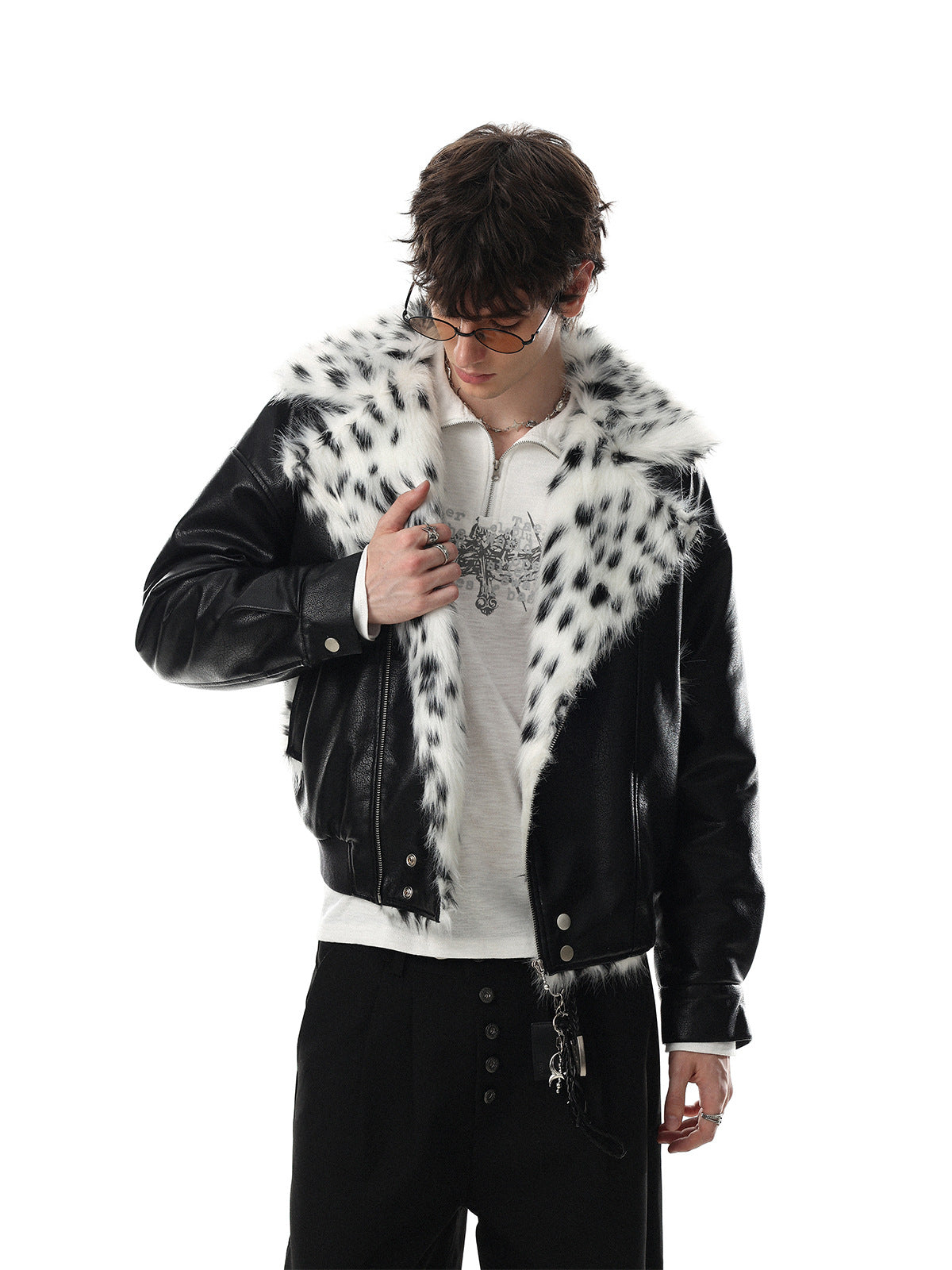 Black faux leather oversized bomber jacket with white and black spotted faux fur collar, front and back view
