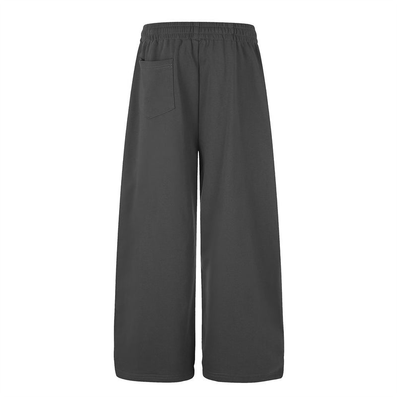 Jogging homme coupe large avec détails de boutons croisés et taille élastique