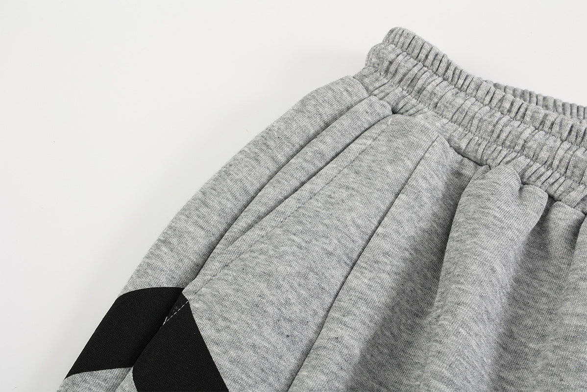 Pantalon de survêtement à jambes larges, rayures diagonales et lettrage – Coupe droite street