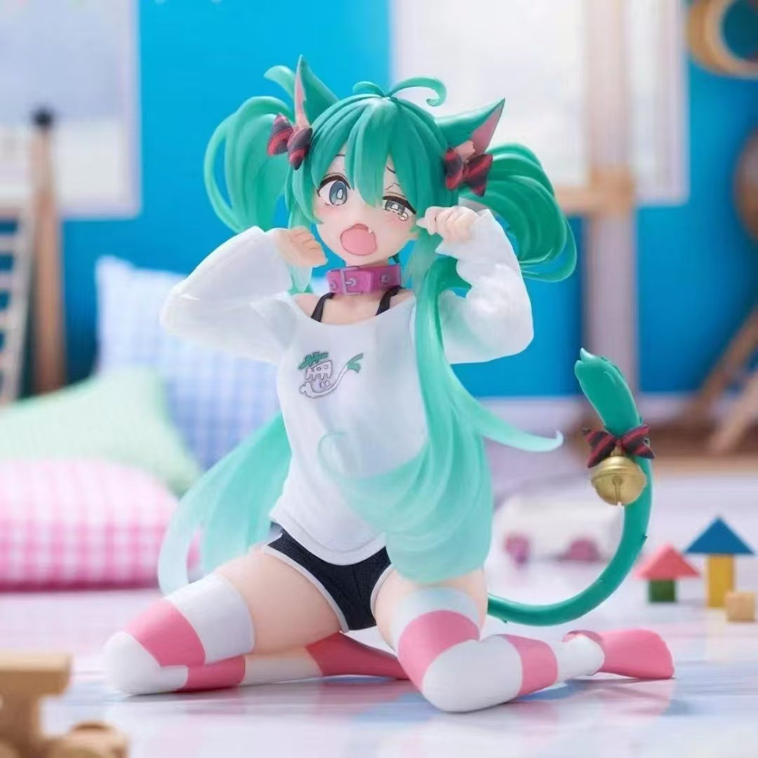 The 11cm PVC figure &quot;Kneeling Cat-Ear Hatsune Miku&quot; features the iconic green twin-tails, cat ears, and a white sweater. With striped pink and white socks, a pink bell collar, vibrant cushions, and playful toys on a pastel floor, it captures the essence of cute anime figures.