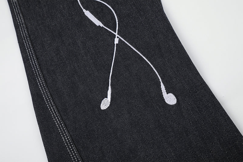 Jean baggy à jambes larges avec broderies et patch en cuir motif notes de musique — Denim noir brut