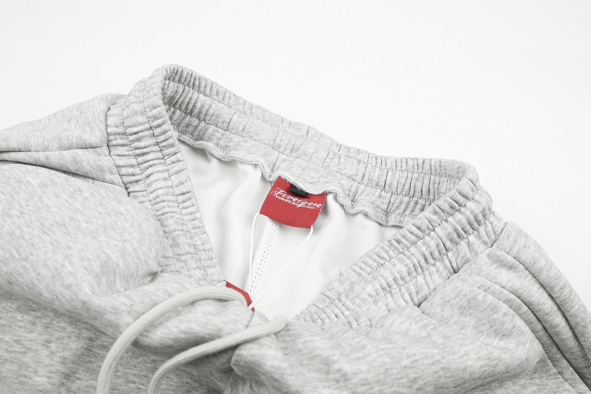 Gerade geschnittene Sweatpants – Colorblock-Baggy-Jogger mit Nieten-Grafik