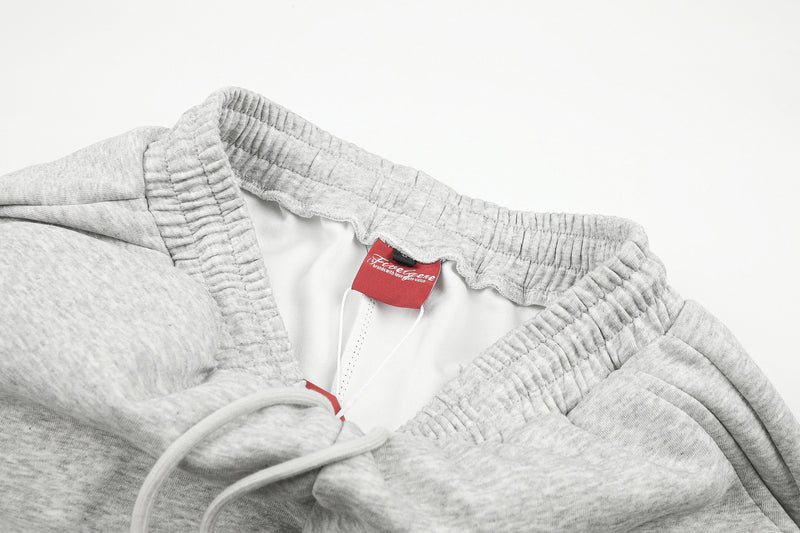 Gerade geschnittene Sweatpants – Colorblock-Baggy-Jogger mit Nieten-Grafik