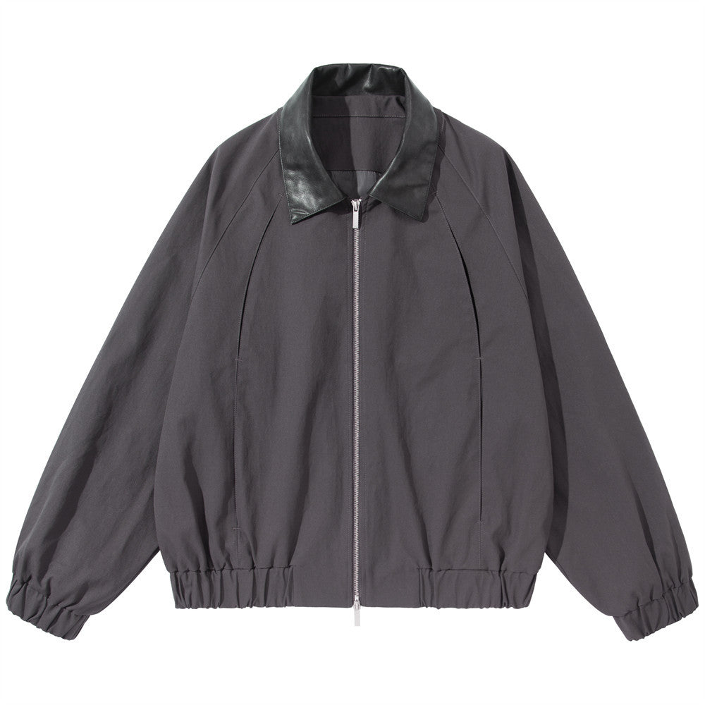 Men's oversized charcoal grey bomber jacket with black PU leather collar, full-length silver zip, elasticated hem and cuffs,