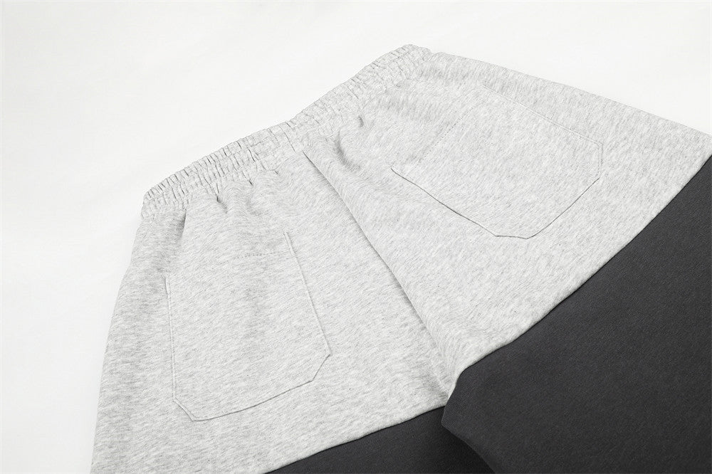 Pantalones de Chándal de Pierna Ancha con Bloques de Color y Detalles Gráficos de Tachuelas Plateadas