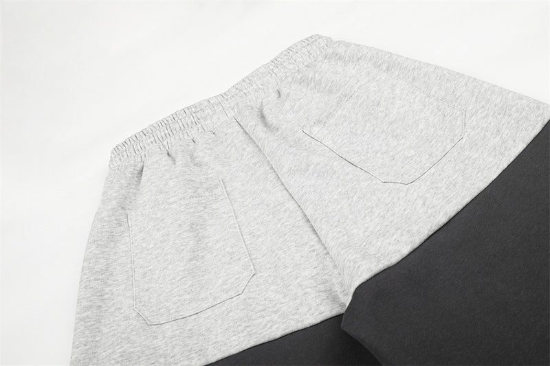 Pantalones de Chándal de Pierna Ancha con Bloques de Color y Detalles Gráficos de Tachuelas Plateadas