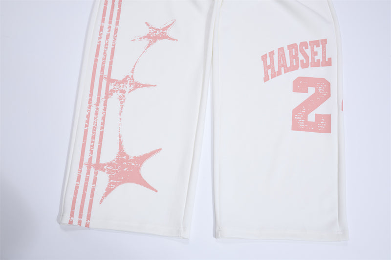 Pantalones de chándal de pierna ancha con estampado gráfico varsity y cintura rosa en contraste