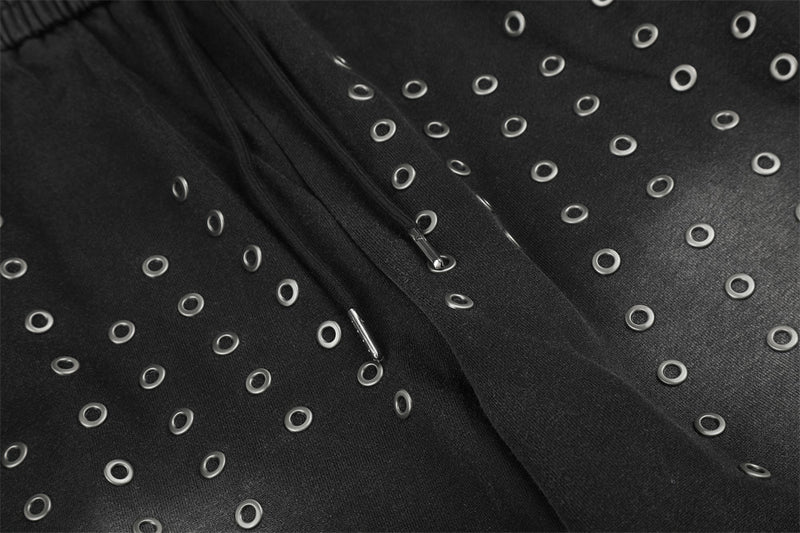 Pantalon de survêtement ample à œillets métalliques, finition délavée à l’acide & ourlet brut