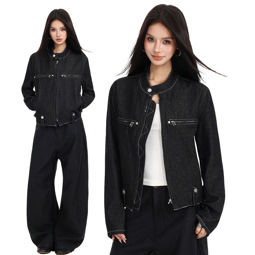 Female model wearing black cropped denim jacket, front view with stand collar and zip pockets