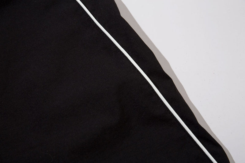 Herren-Trackpants mit kontrastierender Paspel und Colorblock-Seiteneinsätzen