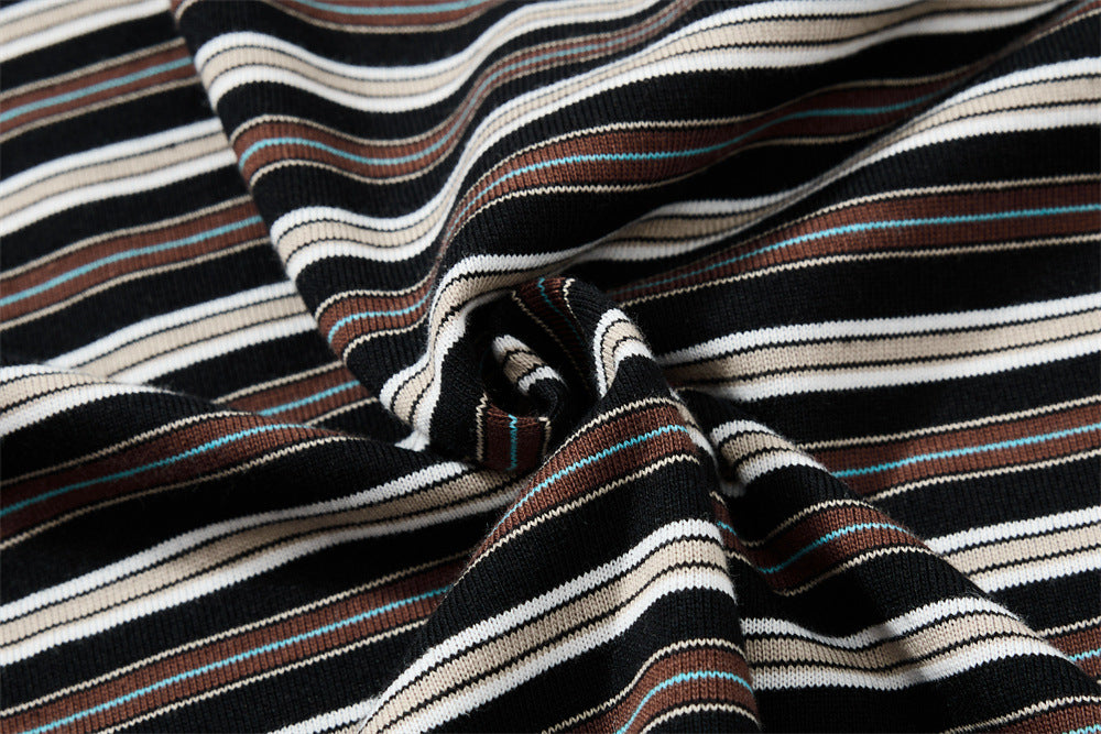 Close-up of gathered striped knit fabric showing soft texture and stretch