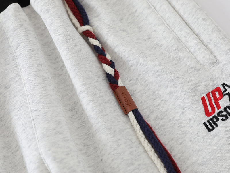 Pantalon de survêtement à jambes larges avec double ceinture et cordon tressé