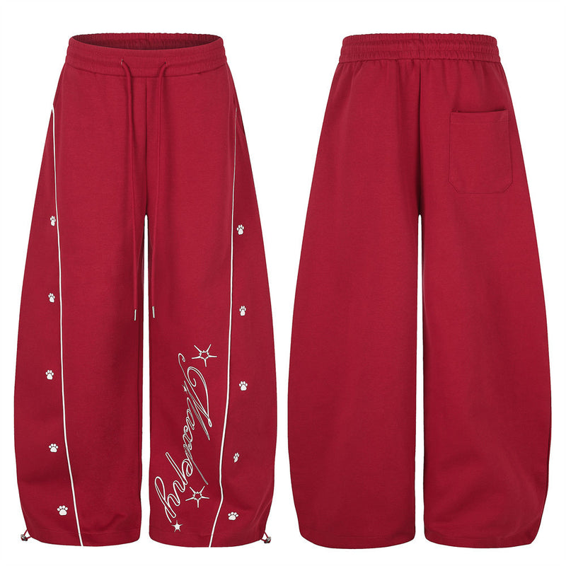 Pantalon de jogging large – Motif patte et coutures courbes rouges
