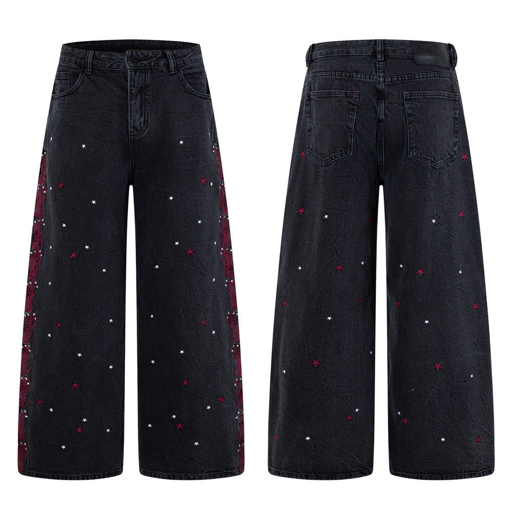 Washed black wide-leg jeans with red and white star embroidery and red floral chain side seam detail, front and back view