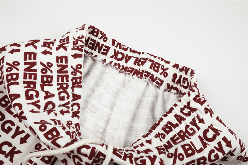 Inside view of white elastic waistband on printed sweatpants