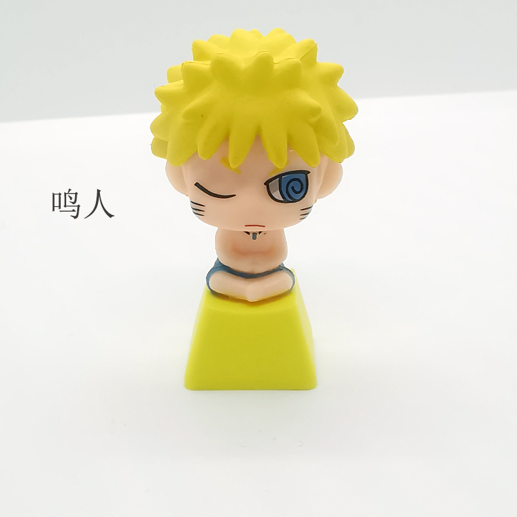 A Naruto character figurine with spiky yellow hair and blue eyes stands on a green triangular base next to Chinese characters, its vibrant anime charm highlighted against a plain white background. This is inspired by the Ninja Masters Keycap Set from the Naruto brand.