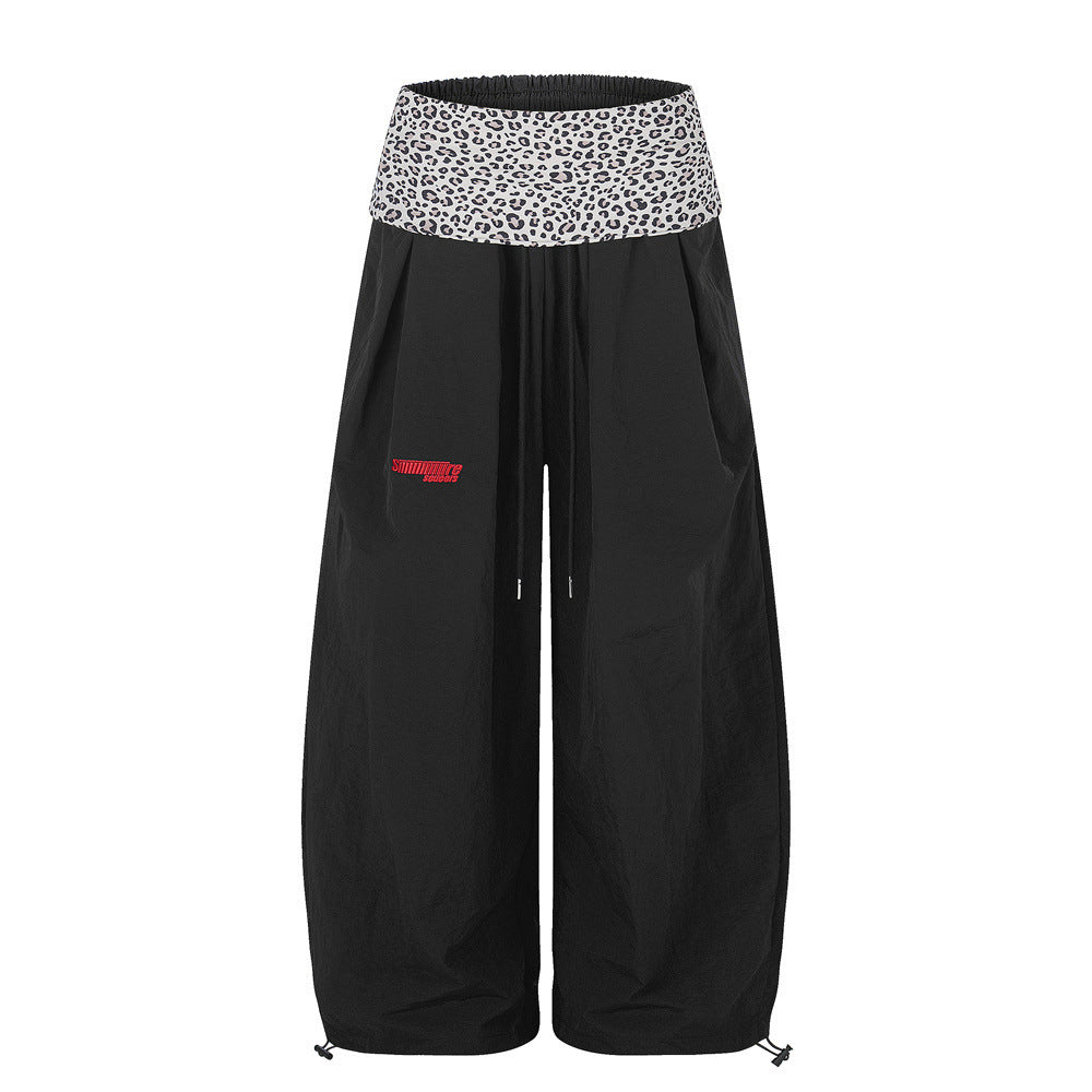 Wide-leg balloon pants with grey leopard print fold-over waistband and drawstring hem in black colorway