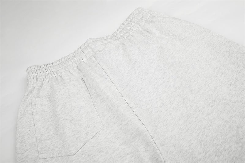Jogging homme coupe large avec détails de boutons croisés et taille élastique