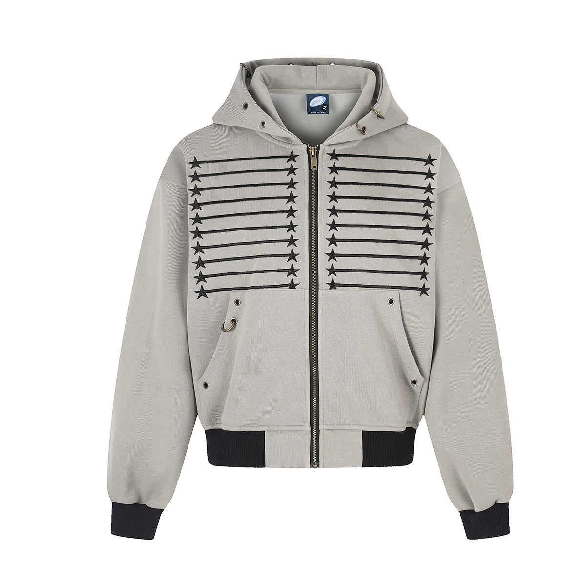 Oversized zip-up hoodie with embroidered star and stripe graphic on chest, brass zipper, metal eyelets, and ribbed black hem