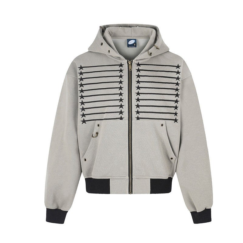 Oversized zip-up hoodie with embroidered star and stripe graphic on chest, brass zipper, metal eyelets, and ribbed black hem