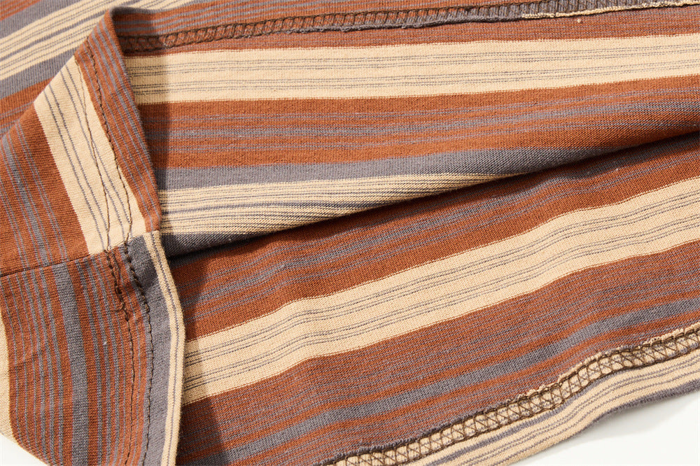 Close-up of striped shirt side seam and hem stitching