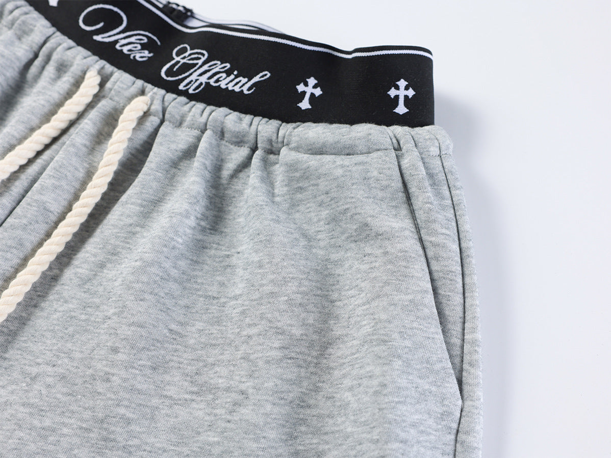 Pantalon de survêtement à jambes larges avec imprimé graffiti cursif et ceinture élastiquée siglée